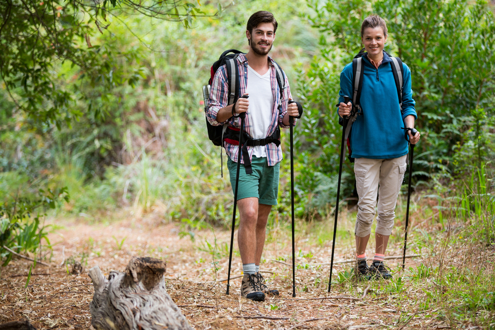 Couple hiking through a forest in the countryside